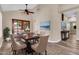 Stylish dining room including dining set and seamless floor plan at 6837 S Roosevelt St, Tempe, AZ 85283
