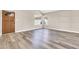 View of entryway with light colored walls and wood floors at 6837 S Roosevelt St, Tempe, AZ 85283
