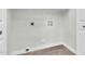 The laundry room with washer hook-ups, a white wall, and baseboards at 6837 S Roosevelt St, Tempe, AZ 85283