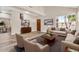 Bright living room featuring wood floors, neutral paint, and large windows at 6837 S Roosevelt St, Tempe, AZ 85283