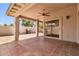 Relax on the covered patio with brick flooring and a ceiling fan at 6837 S Roosevelt St, Tempe, AZ 85283