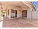 Relax on the covered patio with brick flooring, a ceiling fan, and an abundance of natural light at 6837 S Roosevelt St, Tempe, AZ 85283