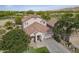 Spacious two-story home with a tile roof on a golf course lot with mature trees and a well manicured lawn at 6847 S 27Th Pl, Phoenix, AZ 85042