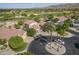 Beautiful home aerial view on a golf course with mature trees and circular drive at 6847 S 27Th Pl, Phoenix, AZ 85042