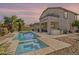 Backyard featuring a pool, spa, outdoor kitchen, and covered patio with a second-story deck at 6847 S 27Th Pl, Phoenix, AZ 85042
