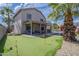 Backyard features a putting green, swimming pool, covered patio, and beautifully maintained landscaping at 6847 S 27Th Pl, Phoenix, AZ 85042
