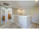 Upstairs hallway with vinyl plank floors leads to bedrooms; neutral paint color creates brightness at 6847 S 27Th Pl, Phoenix, AZ 85042