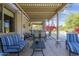 Covered patio with outdoor seating overlooking a sparkling pool and lush landscaping at 6847 S 27Th Pl, Phoenix, AZ 85042