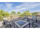 Upstairs patio features a seating area and views of the golf course, mountains, and blue sky at 6847 S 27Th Pl, Phoenix, AZ 85042