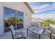 Upstairs patio with seating area offers privacy and relaxed outdoor living and a view of the neighborhood at 6847 S 27Th Pl, Phoenix, AZ 85042