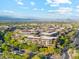 Picturesque aerial shot of luxury residences with tree-lined streets and serene mountain views at 7121 E Rancho Vista Dr # 6001, Scottsdale, AZ 85251