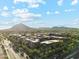 Expansive aerial of upscale condos set against a mountain backdrop, showcasing community's prime location at 7121 E Rancho Vista Dr # 6001, Scottsdale, AZ 85251