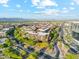 Gorgeous aerial view of luxury condo community with landscaped streets and mountain views in the distance at 7121 E Rancho Vista Dr # 6001, Scottsdale, AZ 85251