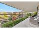 Private balcony offers serene outdoor living space with views of the meticulously landscaped grounds at 7121 E Rancho Vista Dr # 6001, Scottsdale, AZ 85251