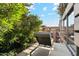 Relax on this private balcony featuring comfortable lounge seating and lush greenery overlooking a sunny landscape at 7121 E Rancho Vista Dr # 6001, Scottsdale, AZ 85251