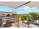 Enjoy breathtaking views from this balcony, furnished with cozy seating and surrounded by vibrant greenery at 7121 E Rancho Vista Dr # 6001, Scottsdale, AZ 85251