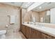 Well-lit bathroom with double sinks, modern fixtures, and neutral tiling at 7121 E Rancho Vista Dr # 6001, Scottsdale, AZ 85251