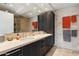 Modern bathroom with dual sinks, stone countertops, and sleek cabinetry providing a luxurious and functional space at 7121 E Rancho Vista Dr # 6001, Scottsdale, AZ 85251