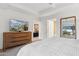 Comfortable bedroom with a dresser and TV at 7121 E Rancho Vista Dr # 6001, Scottsdale, AZ 85251