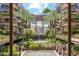Stunning courtyard with lush greenery, mature palm trees, water feature, and architectural design at 7121 E Rancho Vista Dr # 6001, Scottsdale, AZ 85251