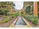 Lush courtyard with central water feature and modern architecture create a serene outdoor setting at 7121 E Rancho Vista Dr # 6001, Scottsdale, AZ 85251