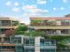 Modern building exterior featuring multiple balconies and lush greenery at 7121 E Rancho Vista Dr # 6001, Scottsdale, AZ 85251