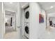 Hallway featuring a stacked washer and dryer and access to the living spaces at 7121 E Rancho Vista Dr # 6001, Scottsdale, AZ 85251