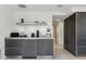 Modern kitchen bar with sleek countertops, minimalist decor, and stylish cabinetry, creating a clean and functional space at 7121 E Rancho Vista Dr # 6001, Scottsdale, AZ 85251