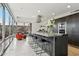Open kitchen featuring a large island with seating, modern appliances, and an open floor plan to the lounge at 7121 E Rancho Vista Dr # 6001, Scottsdale, AZ 85251