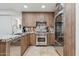 Modern kitchen with stainless steel appliances, wood cabinets, and granite countertops at 7121 E Rancho Vista Dr # 6001, Scottsdale, AZ 85251