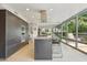 Bright kitchen with a large center island, granite countertops, stainless steel appliances, and expansive windows at 7121 E Rancho Vista Dr # 6001, Scottsdale, AZ 85251