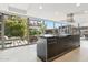 This contemporary kitchen features a large island, granite countertops, and floor-to-ceiling windows with serene views at 7121 E Rancho Vista Dr # 6001, Scottsdale, AZ 85251