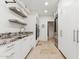 Functional laundry room with granite counters, sink, sleek appliances, and ample storage at 7121 E Rancho Vista Dr # 6001, Scottsdale, AZ 85251