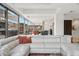 Spacious living room with modern sectional couch and expansive windows offering natural light and city views at 7121 E Rancho Vista Dr # 6001, Scottsdale, AZ 85251