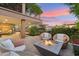 Enjoy the inviting outdoor patio with comfortable seating around a modern fire pit, perfect for relaxing evenings at 7121 E Rancho Vista Dr # 6001, Scottsdale, AZ 85251