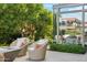 Charming patio with cozy seating and lush landscaping, offering a serene outdoor retreat at 7121 E Rancho Vista Dr # 6001, Scottsdale, AZ 85251