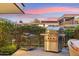 Outdoor patio with a grill, cart, and green hedge in the background at 7121 E Rancho Vista Dr # 6001, Scottsdale, AZ 85251