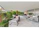 Covered patio featuring elegant lounge area with modern furniture and views of lush landscaping at 7121 E Rancho Vista Dr # 6001, Scottsdale, AZ 85251