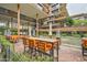 A furnished outdoor dining space with sleek patio furniture and a serene view of the community at 7121 E Rancho Vista Dr # 6001, Scottsdale, AZ 85251
