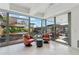 A relaxing lounge area with comfy seating and floor to ceiling windows overlooks the beautiful exterior community gardens at 7121 E Rancho Vista Dr # 6001, Scottsdale, AZ 85251