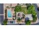 Overhead view showcasing the community pool, playground, sports court, and surrounding green spaces and parking at 753 N Port Dr, Gilbert, AZ 85233