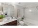 Bathroom with vanity, mirror, toilet, bathtub and shower head at 753 N Port Dr, Gilbert, AZ 85233