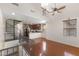 Lofted living space with a spiral staircase, wood flooring, and a view of the kitchen at 753 N Port Dr, Gilbert, AZ 85233