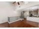 Open-concept living area featuring hardwood floors and a spiral staircase with lots of room for furniture at 753 N Port Dr, Gilbert, AZ 85233