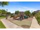 Community playground with a slide, climbing structure, and other play equipment on a safe, cushioned surface at 753 N Port Dr, Gilbert, AZ 85233