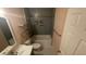 Bathroom with a tiled shower, modern fixtures, floating shelves, and mosaic tiled niche for a stylish touch at 8050 E Oak St, Scottsdale, AZ 85257