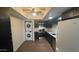 Modern kitchen equipped with stainless steel appliances and granite countertops, complemented by an adjacent washer/dryer unit at 8050 E Oak St, Scottsdale, AZ 85257