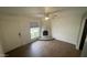 Cozy living room with a unique fireplace, ceiling fan, and wood-look tile flooring at 8050 E Oak St, Scottsdale, AZ 85257