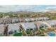 The aerial shot shows homes with backyards, artificial turf, desert landscaping, and mountain vistas in the background at 8127 E June St, Mesa, AZ 85207