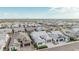 An aerial view captures numerous homes in a community, highlighting the uniformity and spaciousness of the neighborhood at 8127 E June St, Mesa, AZ 85207